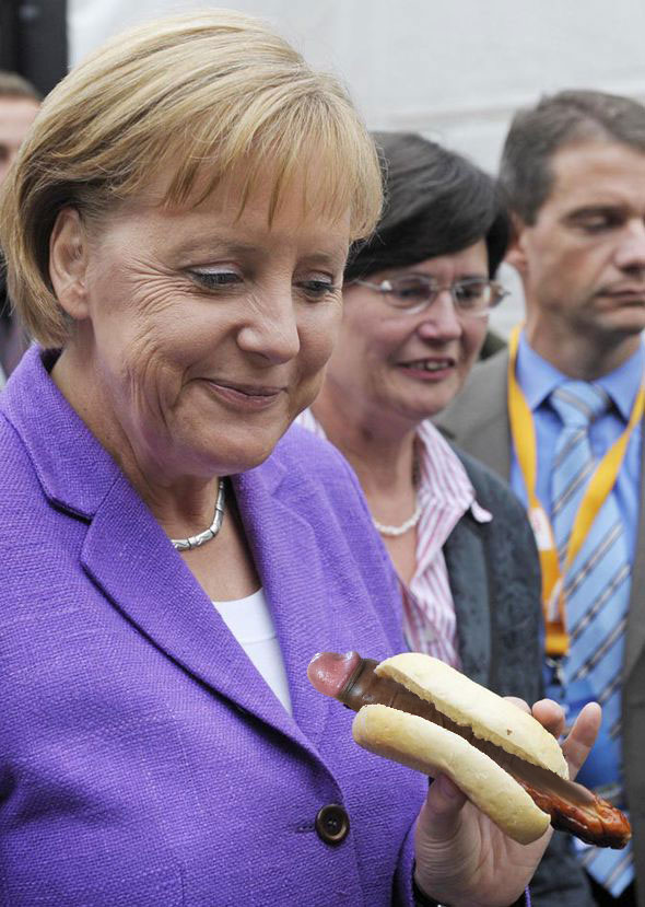Ooh this is super nice Hot Oriental Dog. Let me taste it. But who is going to pay my lunch asks Frau Ferkel Merkel. Dont You worry Frau Ferkel Merkel. The whole Europa is forced to pay your lunch