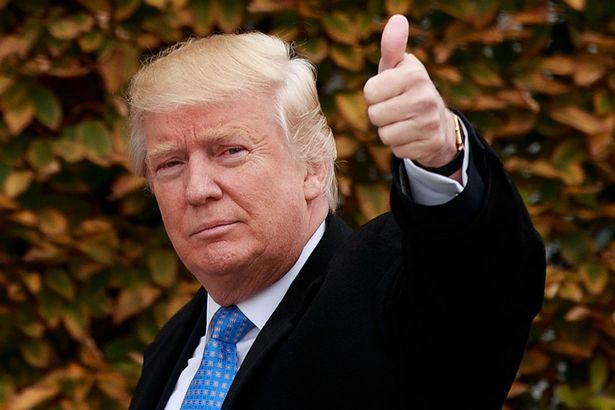US President-elect Donald Trump gives a thumbs up